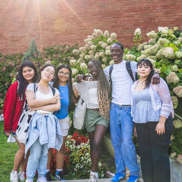 Six CWRU students pose for a picture outside of Thwing Student Center.